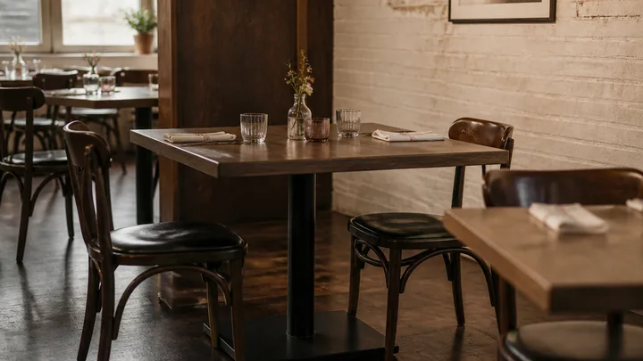 Rectangular restaurant table on a pedestal base with bentwood chairs